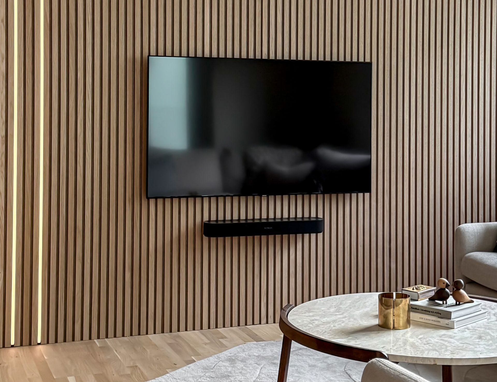 Supreme TV Wall Mounting technician installing a large flat-screen TV in a Gauteng home